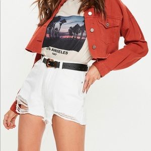White high-waisted distressed shorts